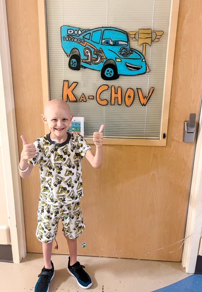 Wilder giving two thumbs up outside his hospital room