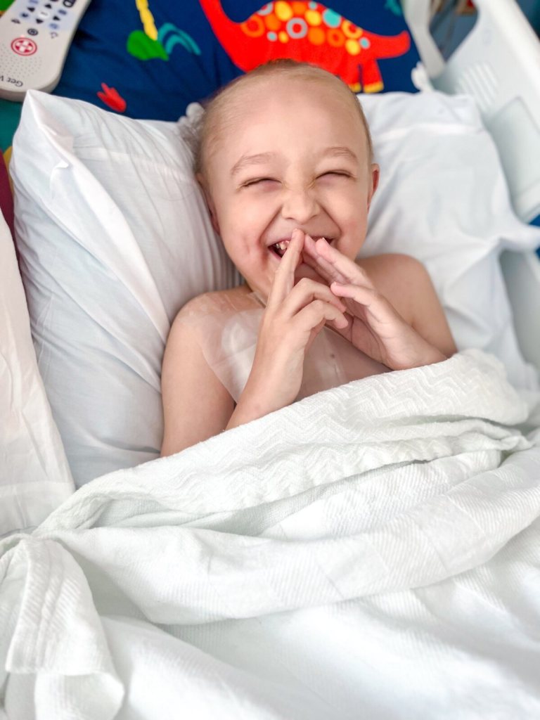 Wilder laughing in his hospital bed